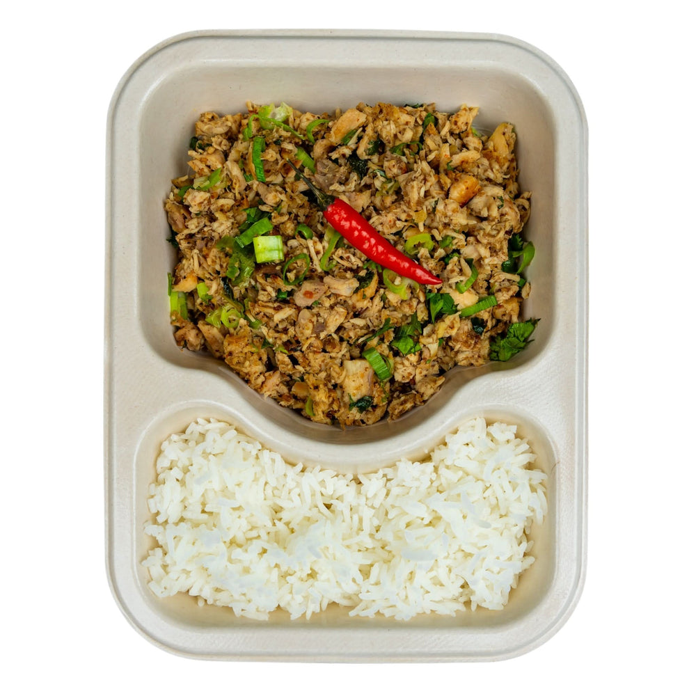 Minced chicken salad with jasmine rice in a compostable meal tray.