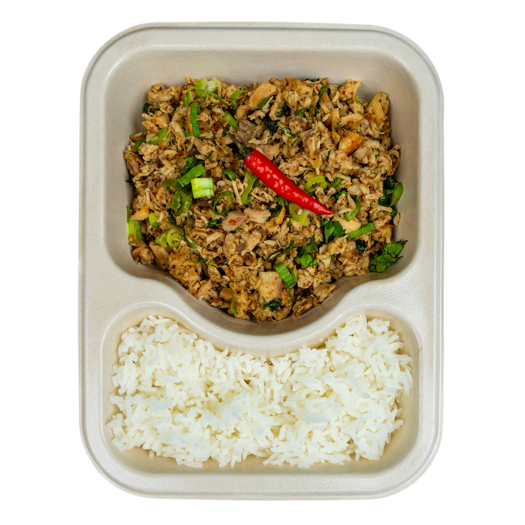 Minced chicken salad with jasmine rice in a compostable meal tray.